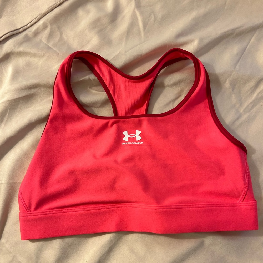 Under Armour pink sports bra size medium, good condition, never worn